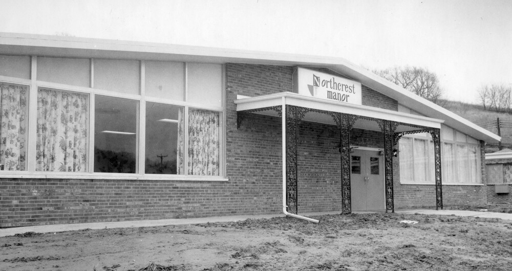 Brick building with large windows.