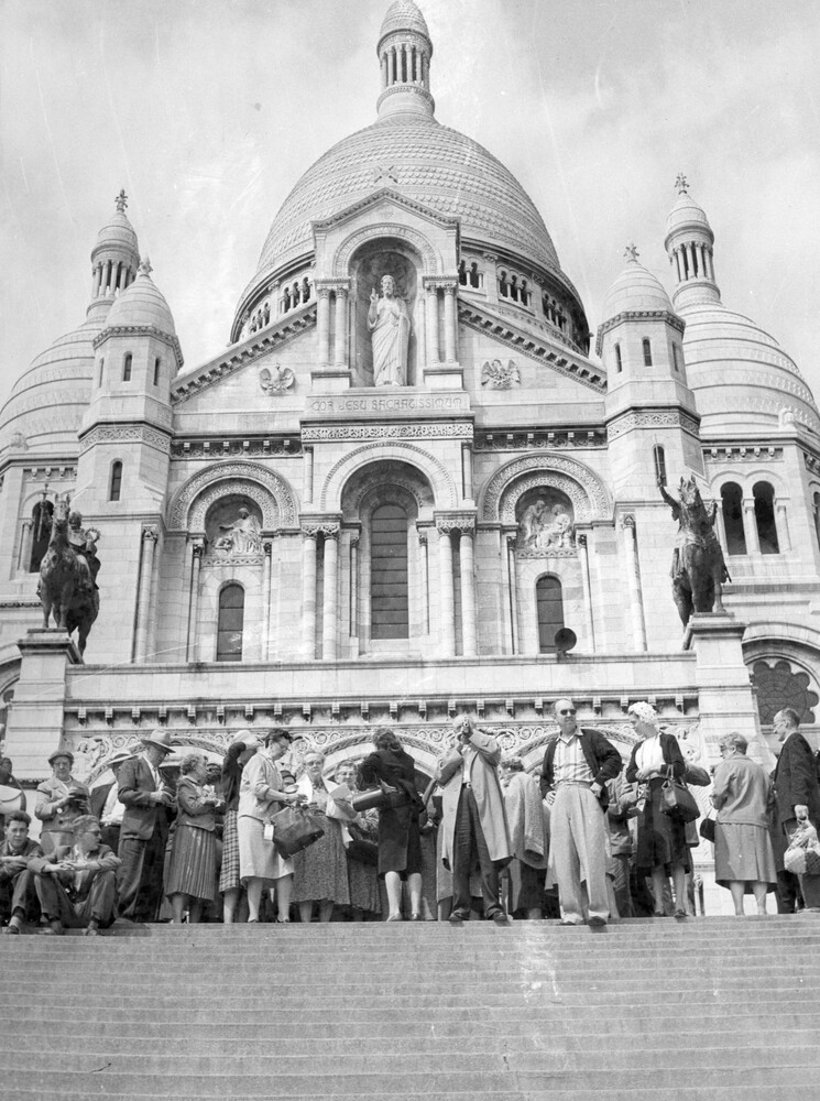 Tourists in front of a large church.