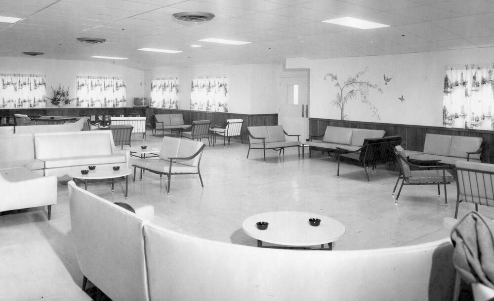Large room with tables and chairs.