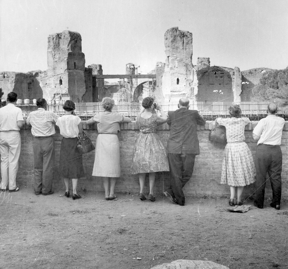 Tourists looking at ancient ruins.