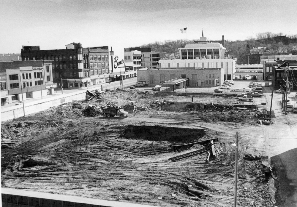 Demolition/construction site, surrounded by other city buildings