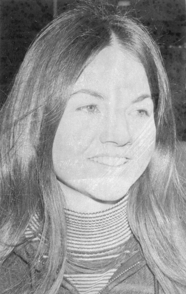 Head shot of young woman with long hair