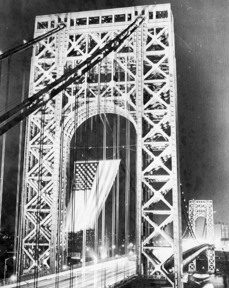 Flag waving on a bridge.