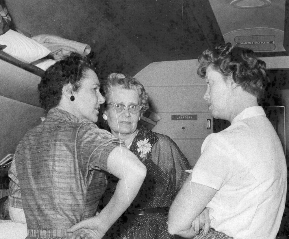 Three women conversing.