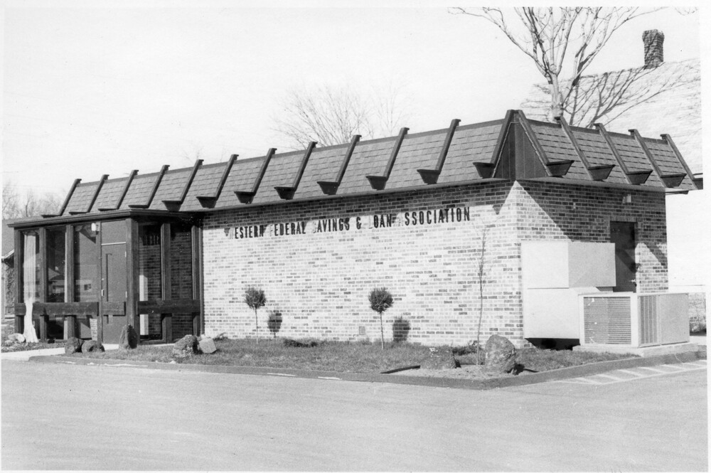 side and front of one-story brick building