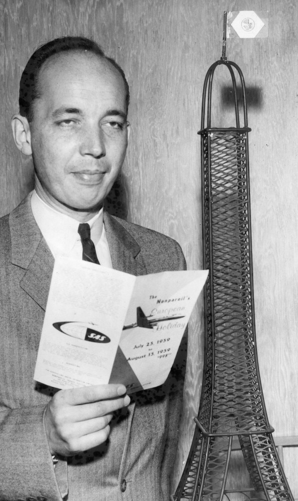 Man holding a brochure.