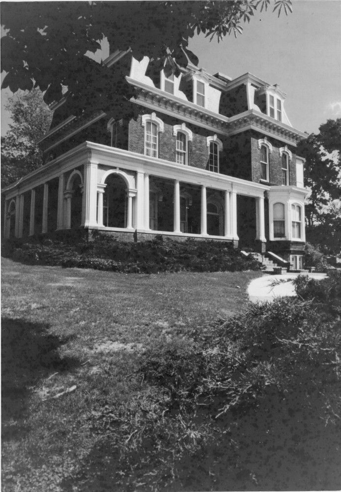 Victorian house exterior from corner of front of house.