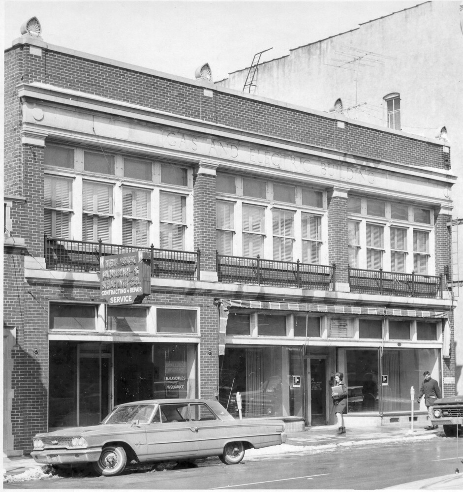 front of brick building on city street