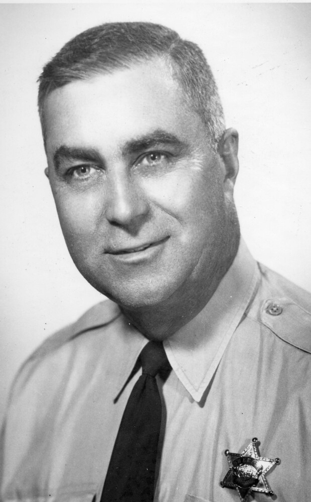 Headshot of man in uniform with sheriff's badge