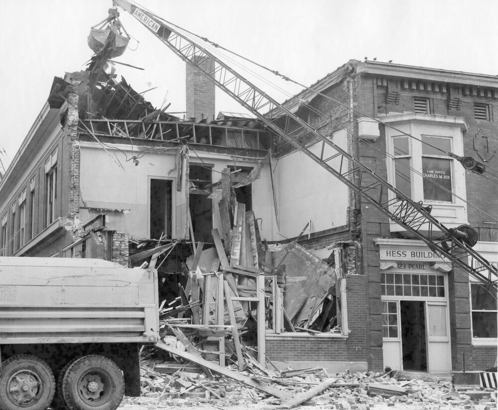 A crane demolishing a building.