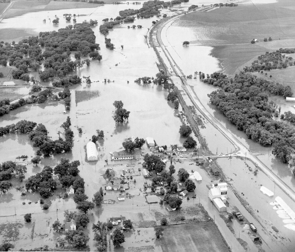 A flooded countryside and highway.