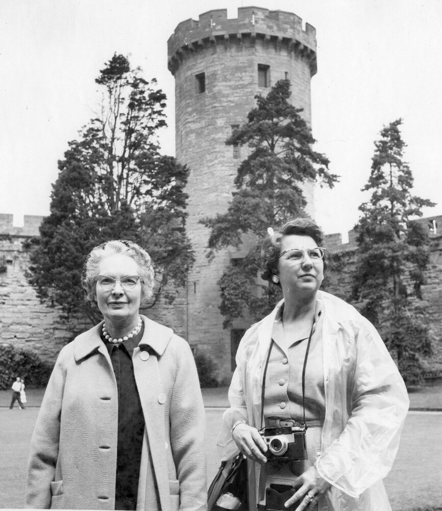 Two women at a castle.
