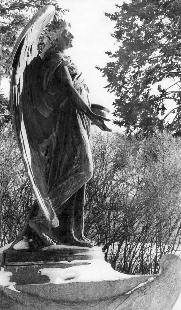 side of large outdoor statue of an angel
