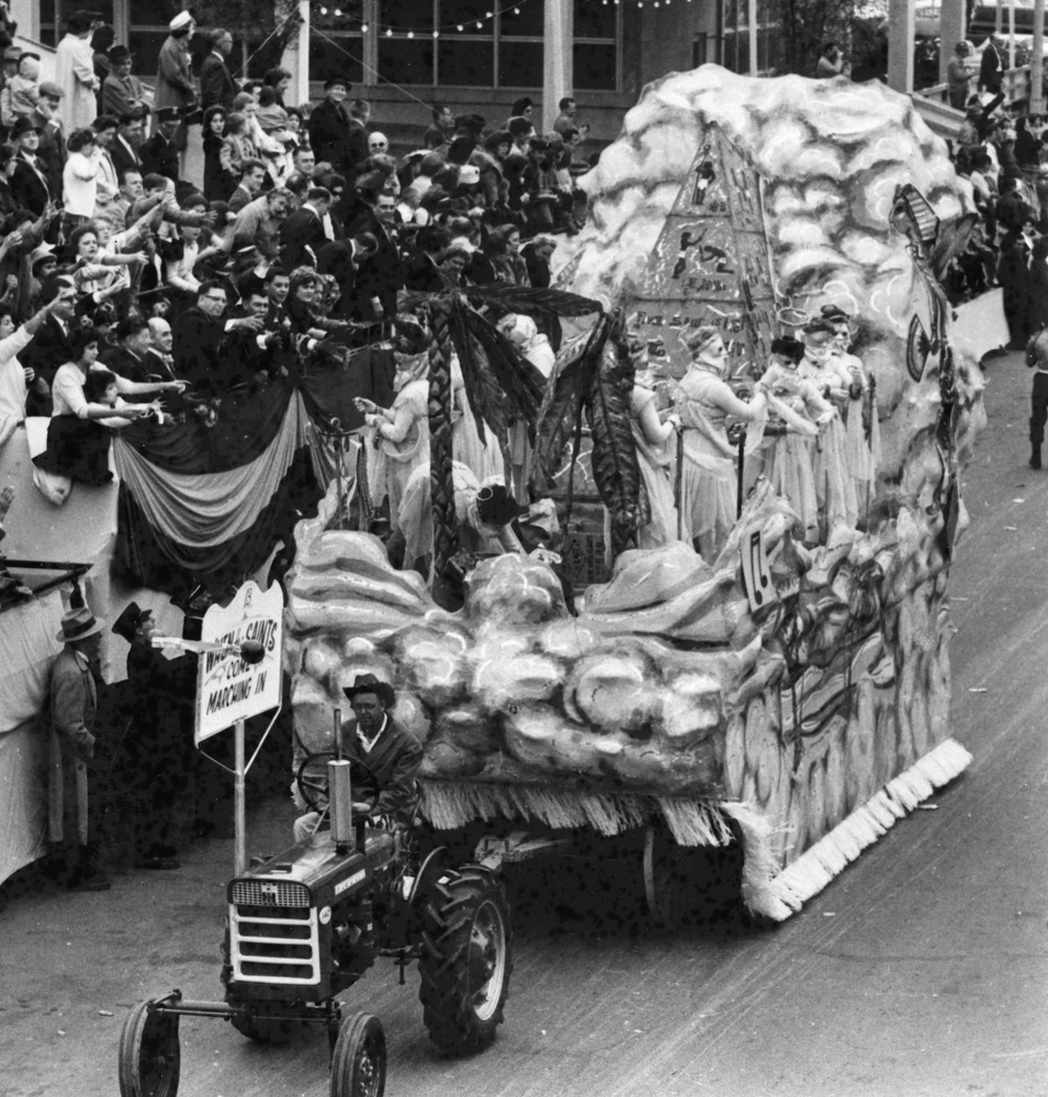 Tractor pulling a parade float.