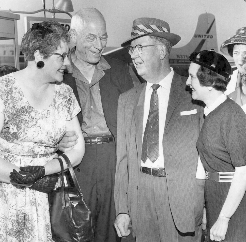 Two couples chatting.
