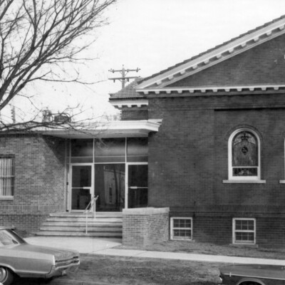 brick building with steps into addition to building