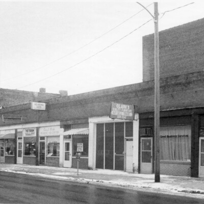 city block of old brick buildings, with updated fronts