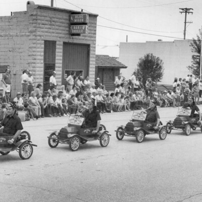  Harlan Shriner's in mini vehicles on parade.