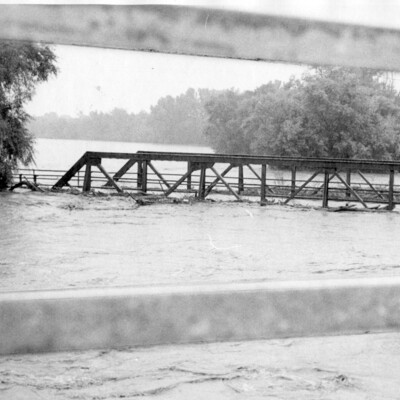 Bridge surrounded by flood waters.