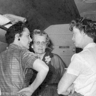 Three women conversing.