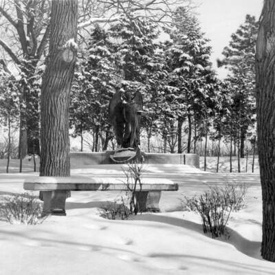 large statue of angel in winter landscape