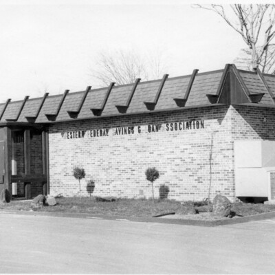 side and front of one-story brick building
