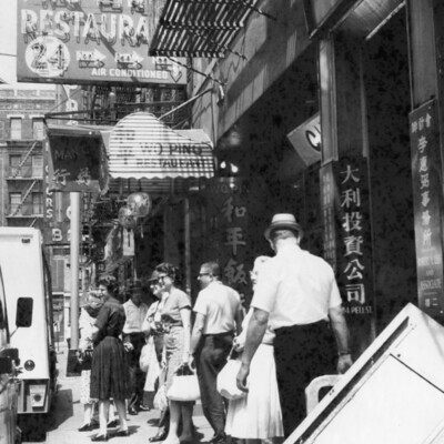 A group of tourists on a busy street.