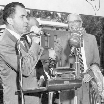Three men at a podium.