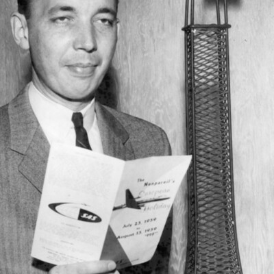 Man holding a brochure.