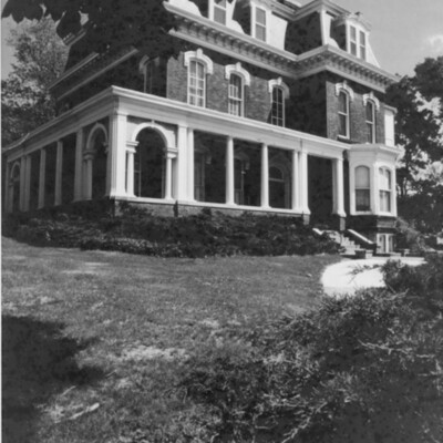 Victorian house exterior from corner of front of house.