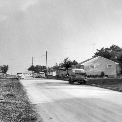 Several homes along a road.