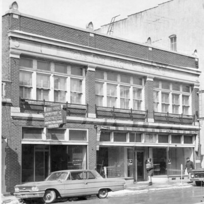 front of brick building on city street