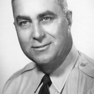 Headshot of man in uniform with sheriff's badge