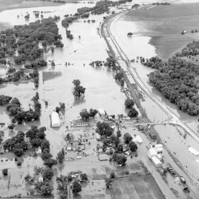 A flooded countryside and highway.