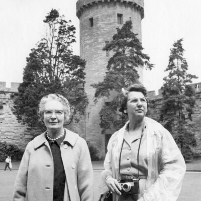 Two women at a castle.