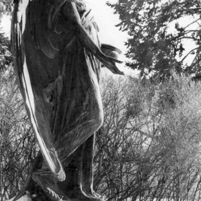 side of large outdoor statue of an angel