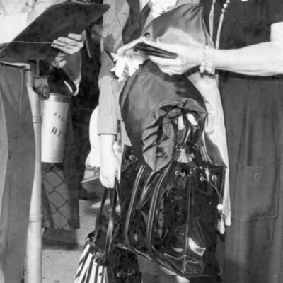 Two women checking in at an airport.