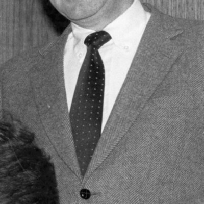 Photo of smiling man in a suit